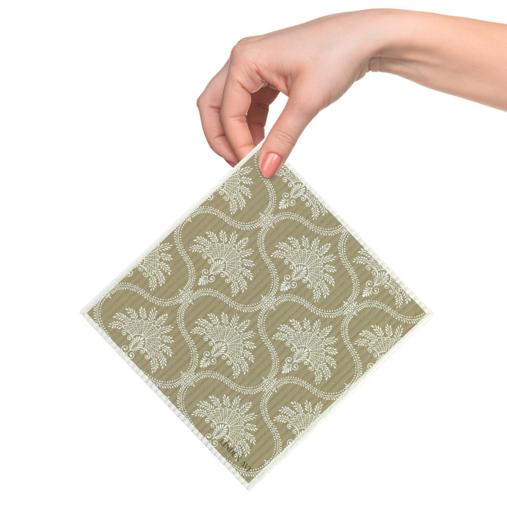 Beige damask patterned reusable dishcloth held in hand from Linden Ave Marigold Manor